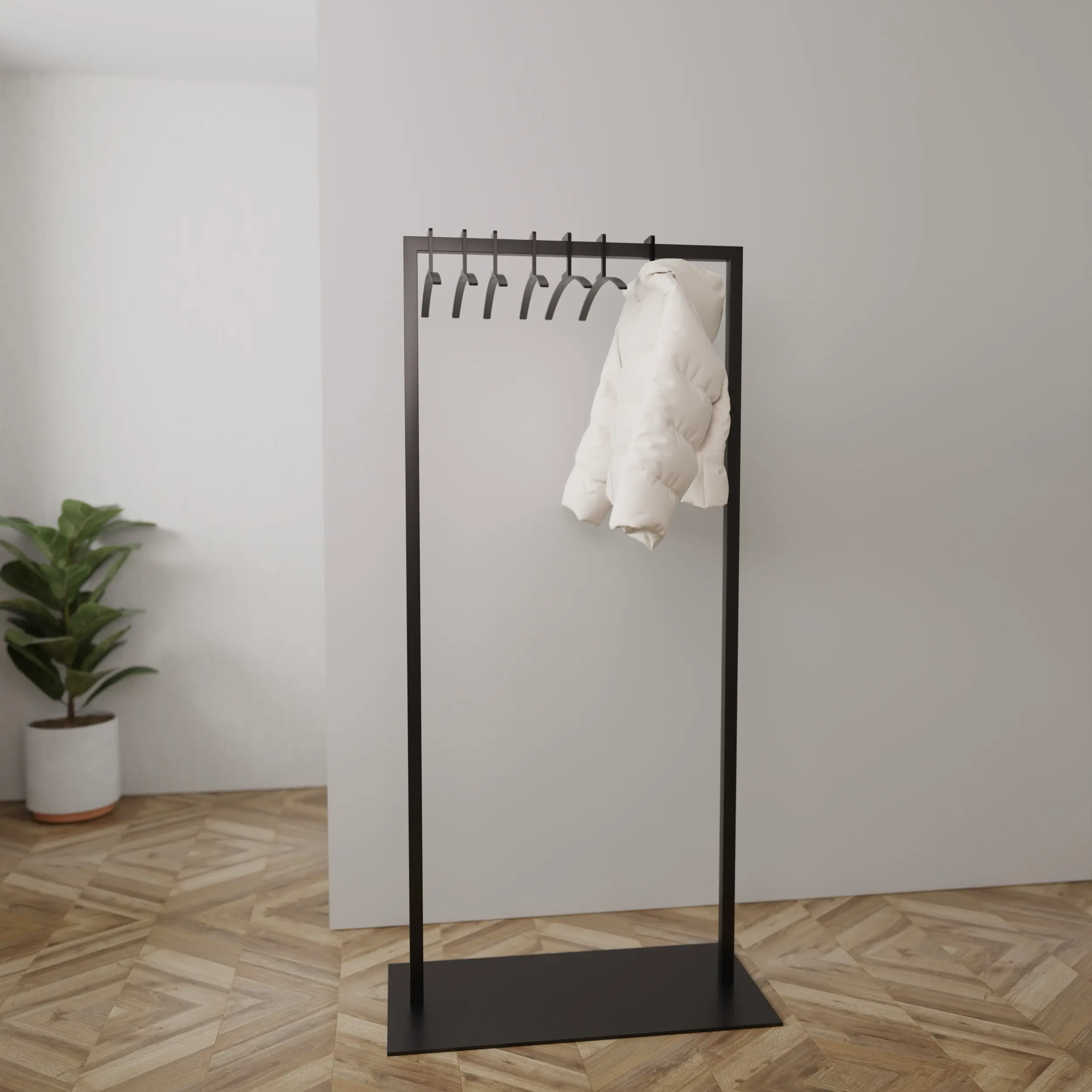 Garderobe Taren schwarz in einem Interieur mit Kleidung an der Wand montiert.