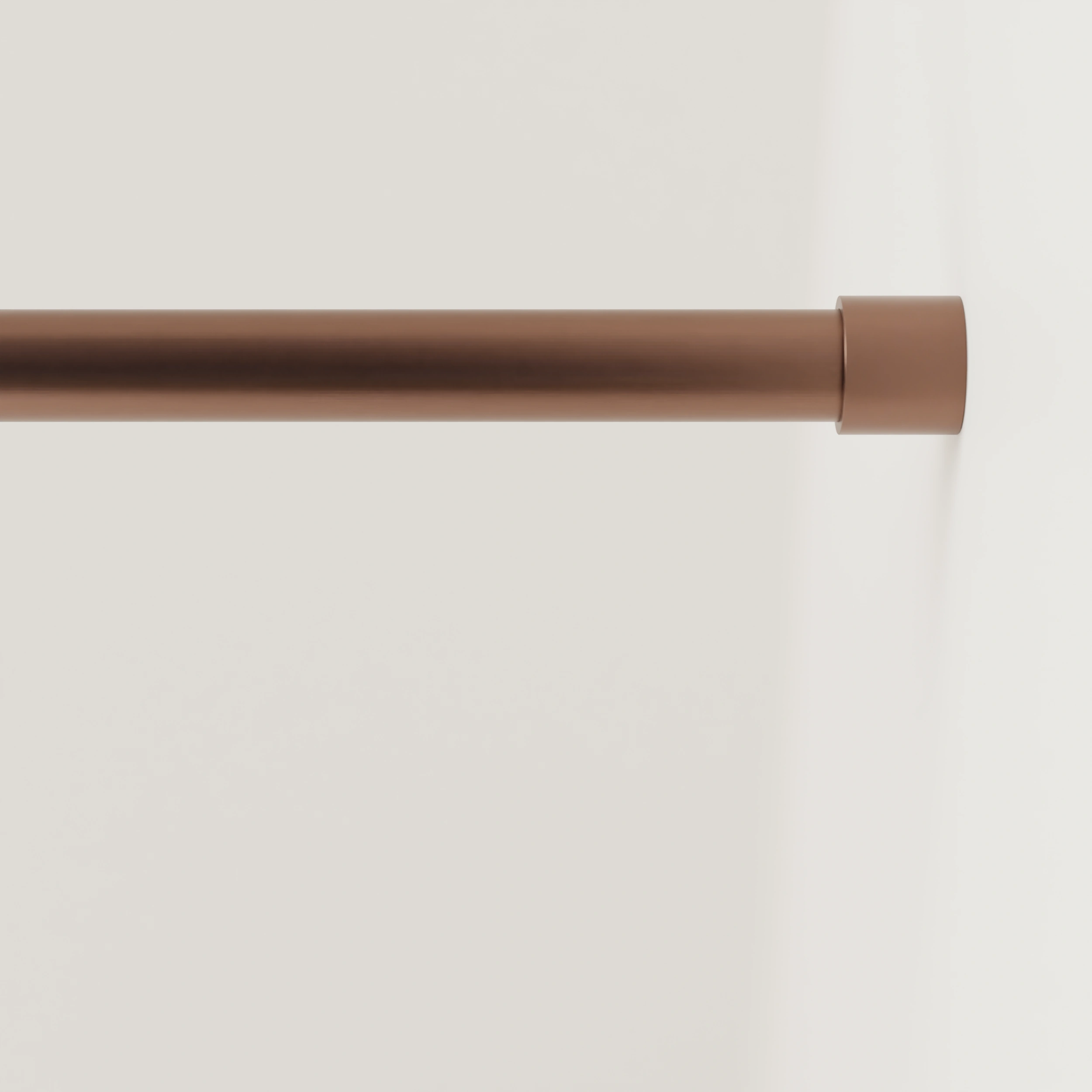 Garderobestang B rond brons aan de wand gemonteerd in een interieur met kleding.
