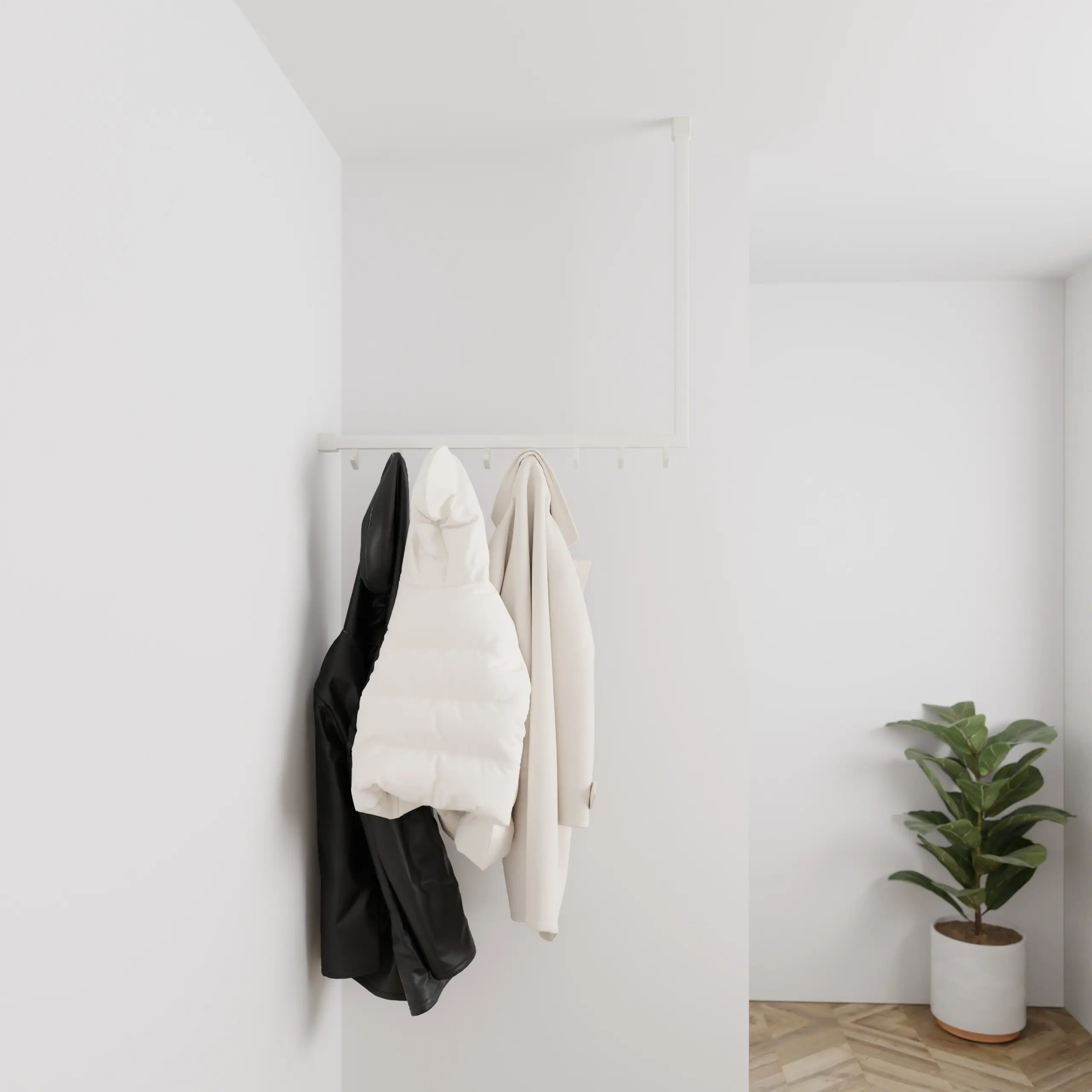Garderobe Lovan quadratisch weiß in einem Interieur mit Kleidung an der Wand montiert.