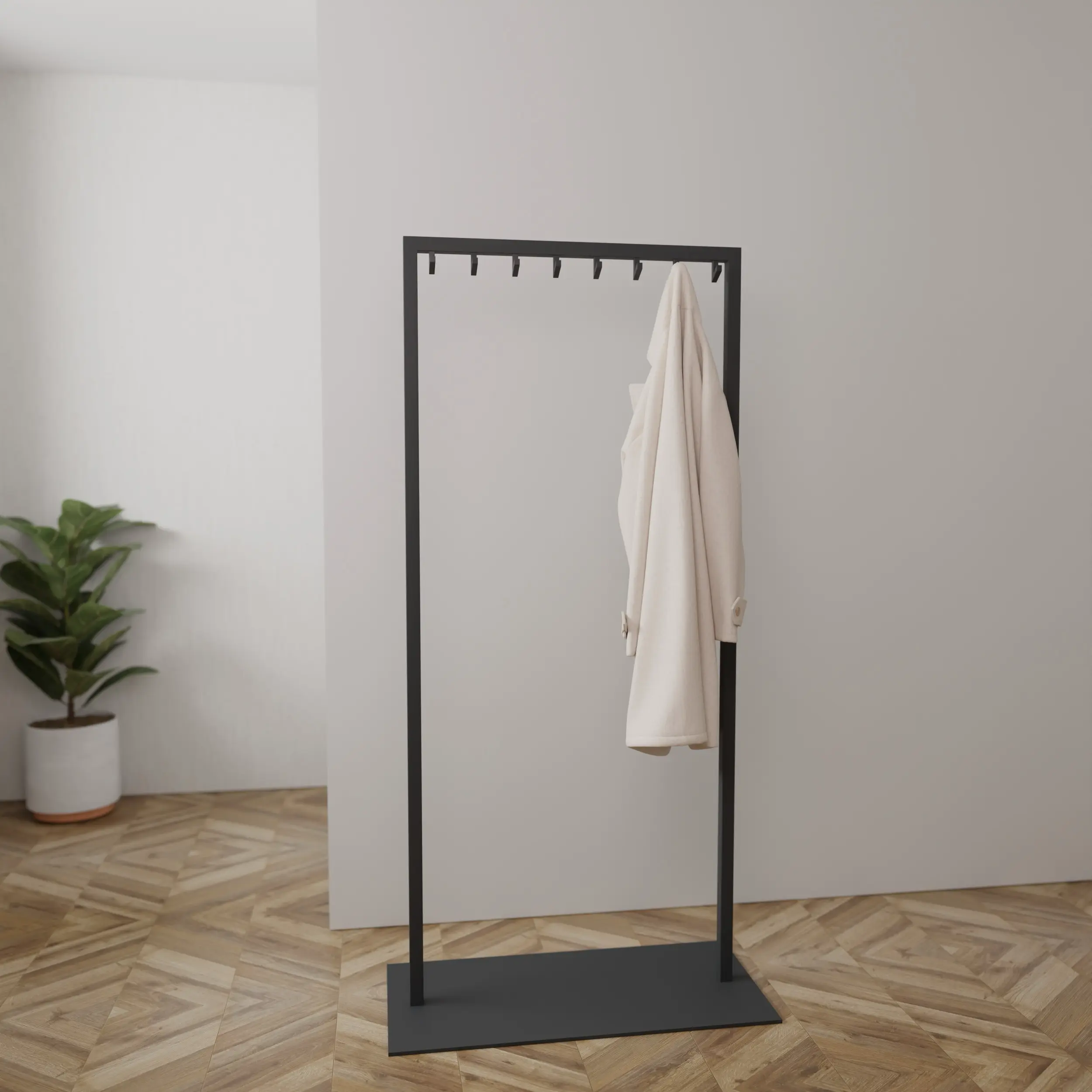 Garderobe Taren schwarz in einem Interieur mit Kleidung an der Wand montiert.