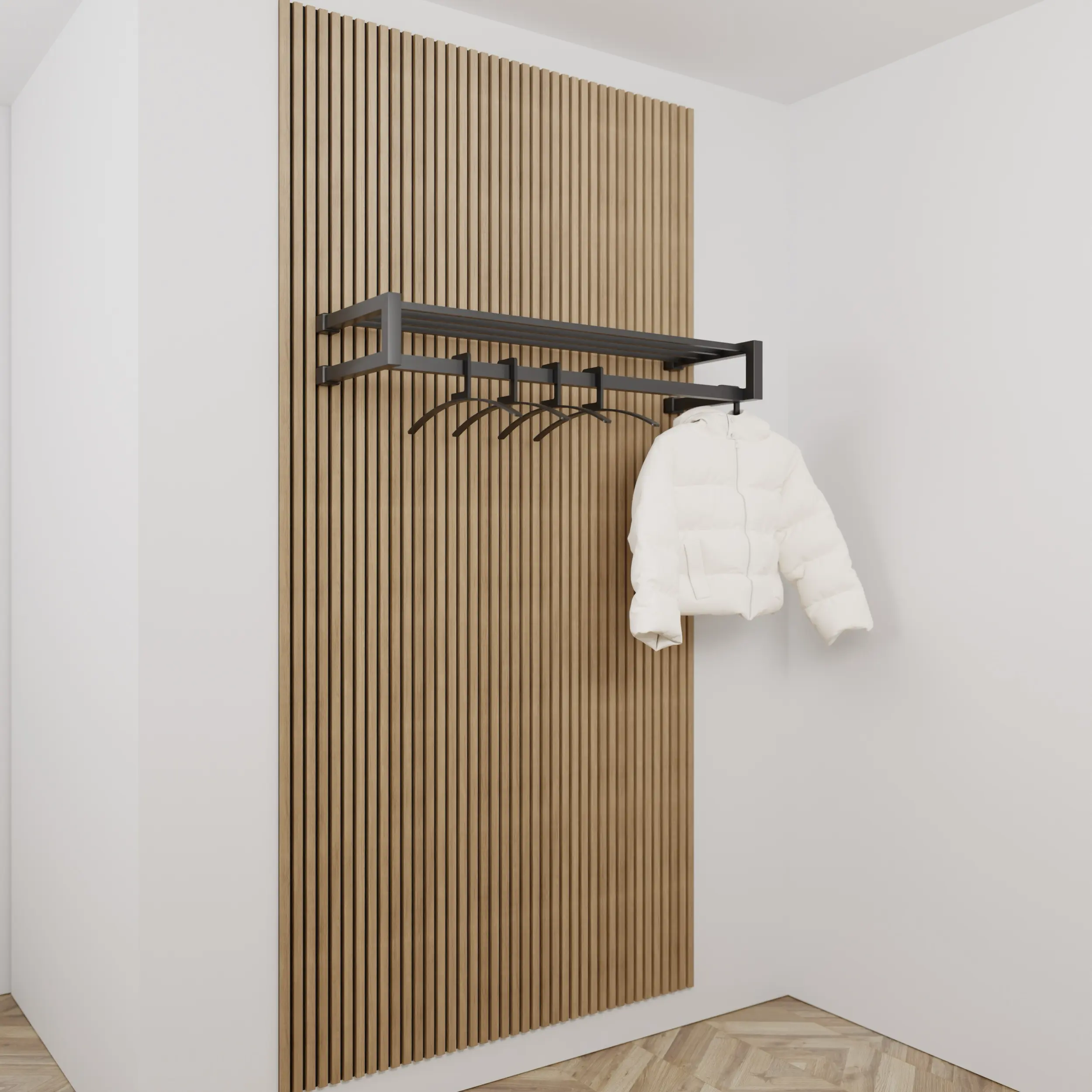 Garderobe Uven quadratisch schwarz in einem Interieur mit Kleidung an der Wand montiert.