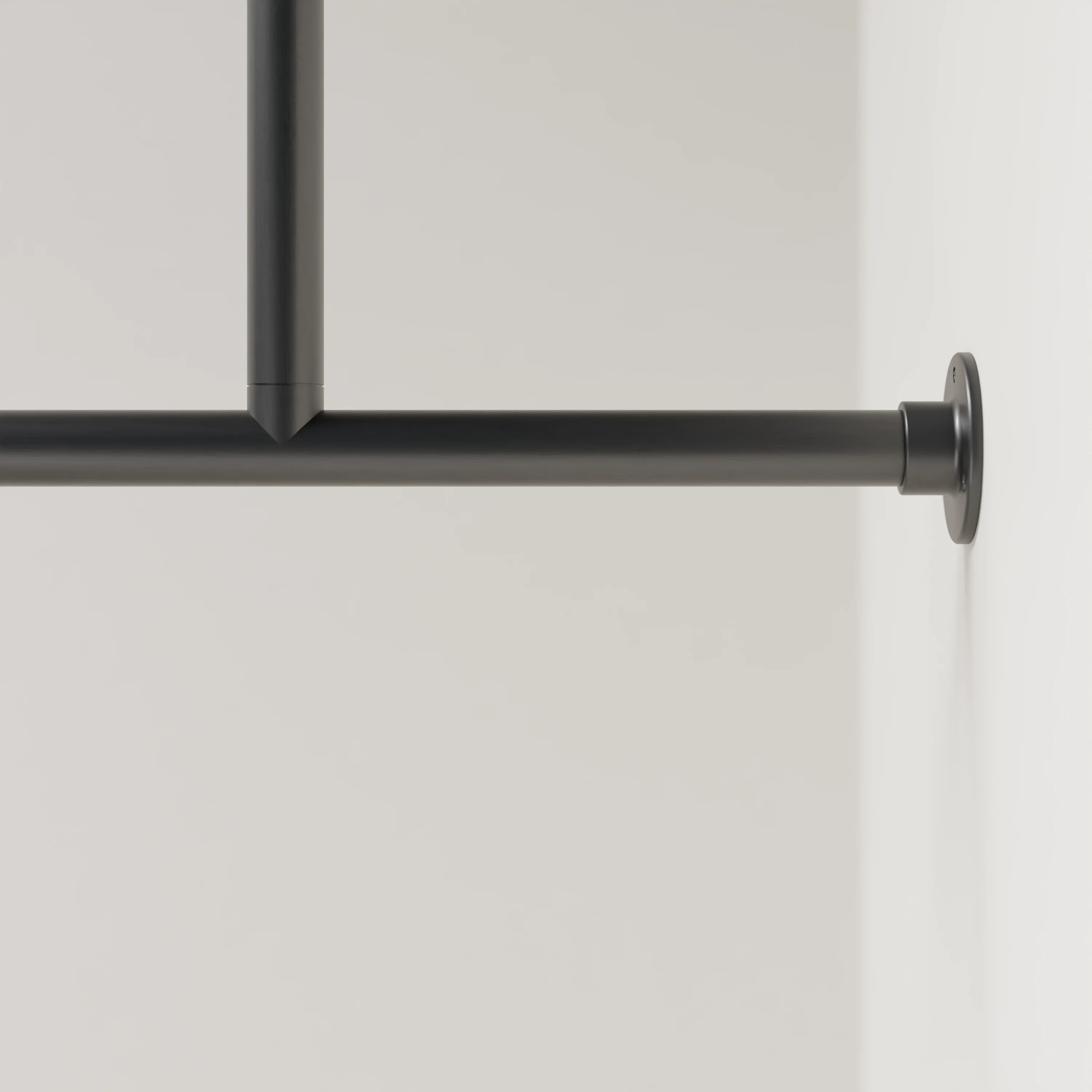 Detailbeeld van Garderobestang A aan de wand, zwart, rond Ø34mm, zonder haken, met tussensteun.