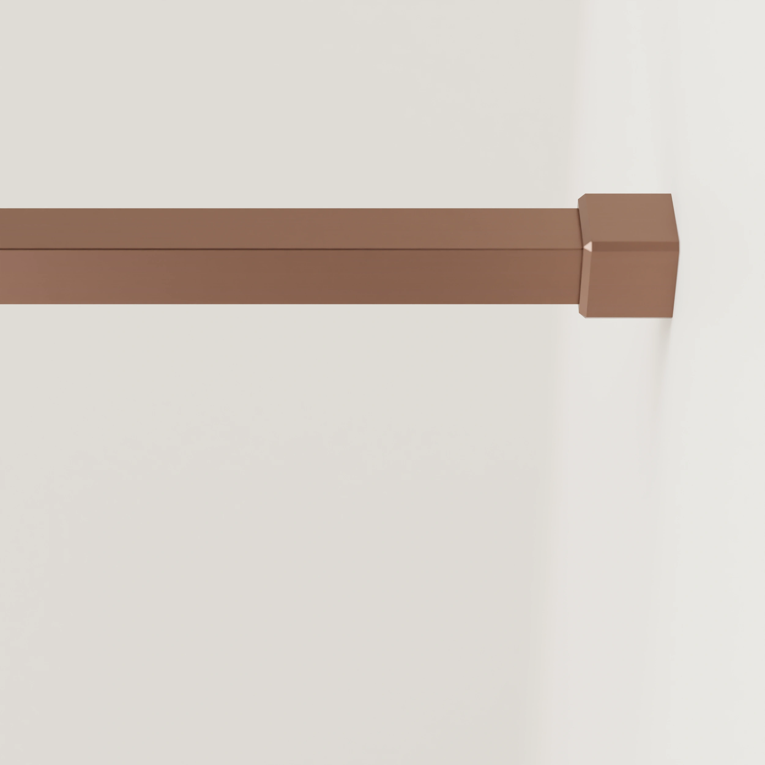 Garderobestang B vierkant brons aan de wand gemonteerd in een interieur met kleding.