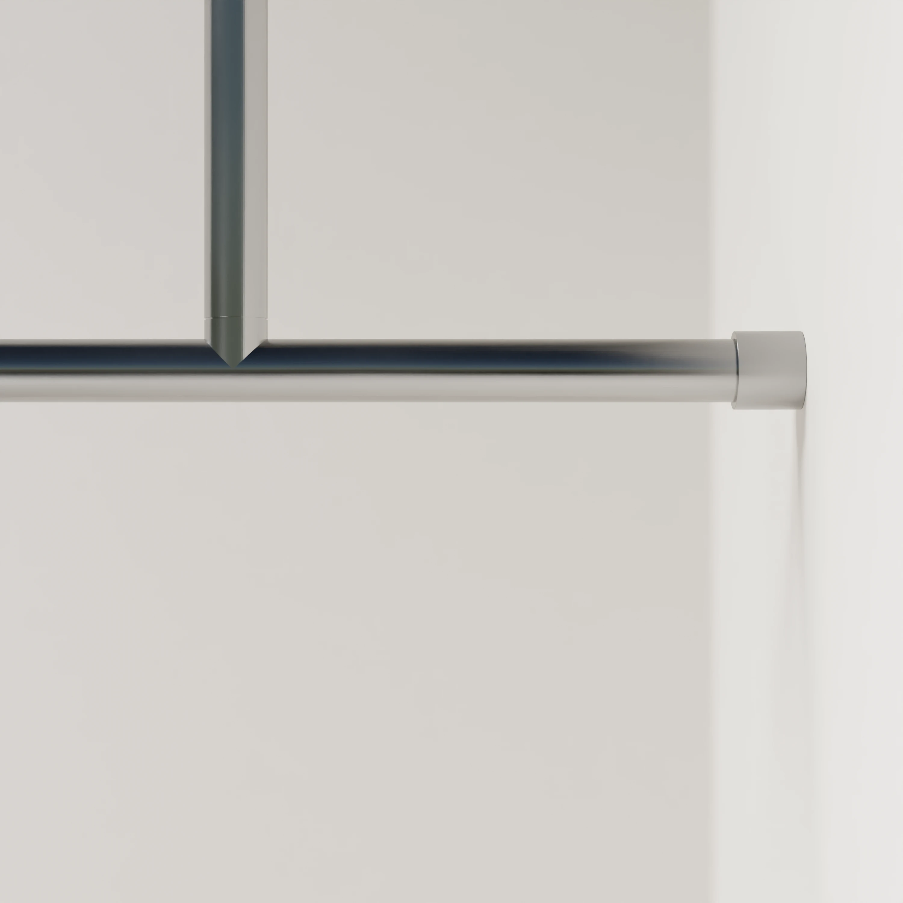 Clothes rail B round stainless steel mounted on the wall in an interior with clothing.