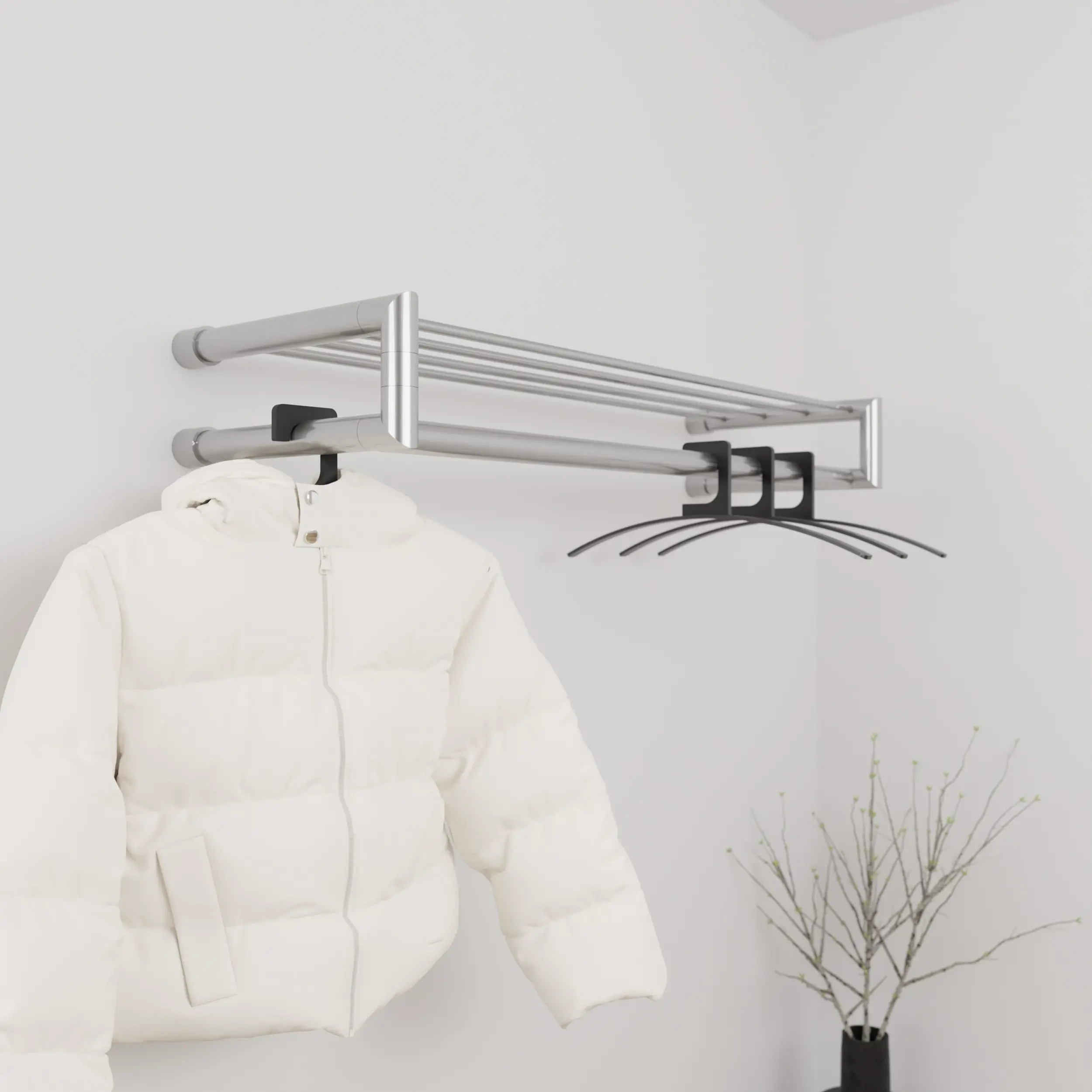 Garderobe Uven rund Edelstahl in einem Interieur mit Kleidung an der Wand montiert.