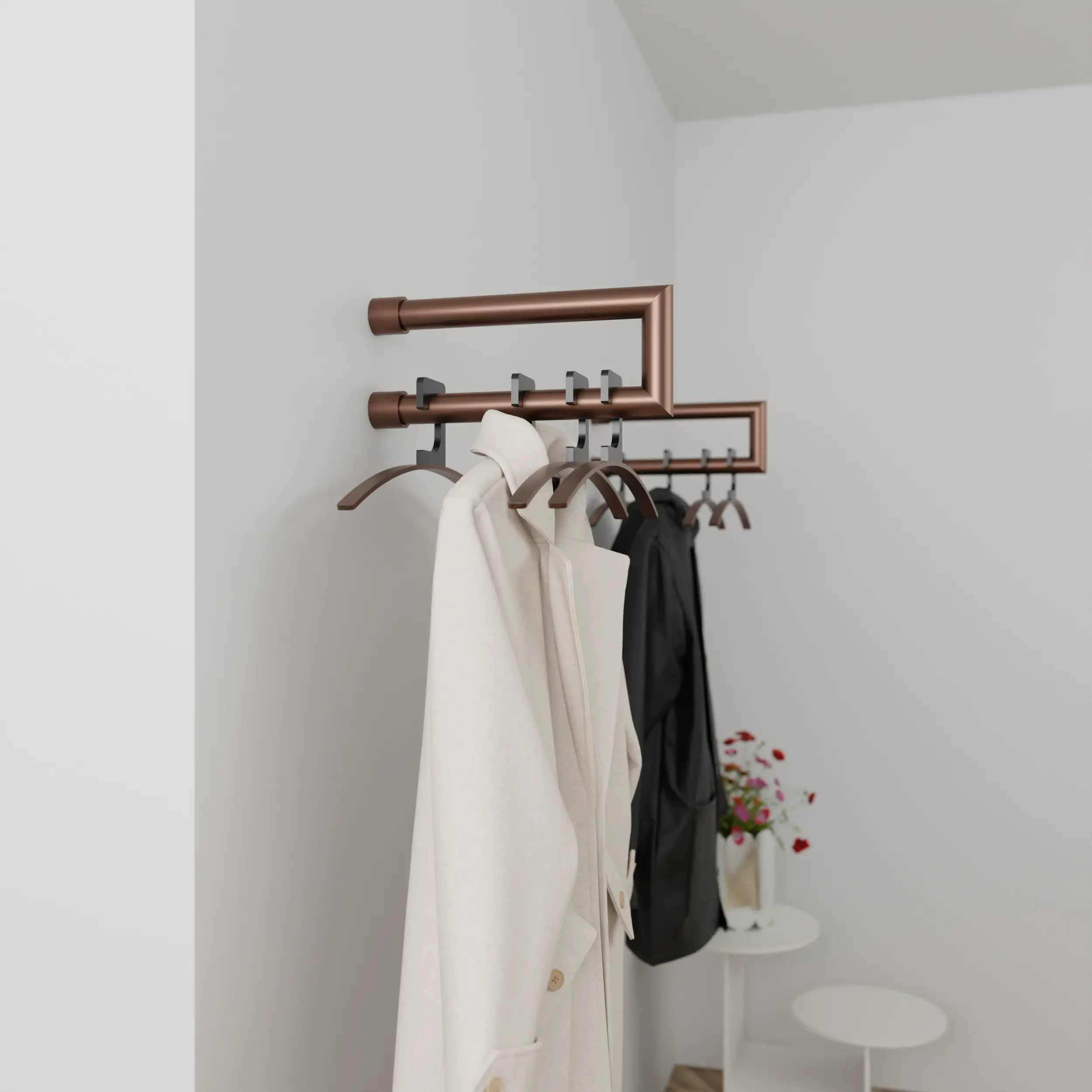 Wandkapstok Eslin rond brons aan de wand gemonteerd in een interieur met kleding.