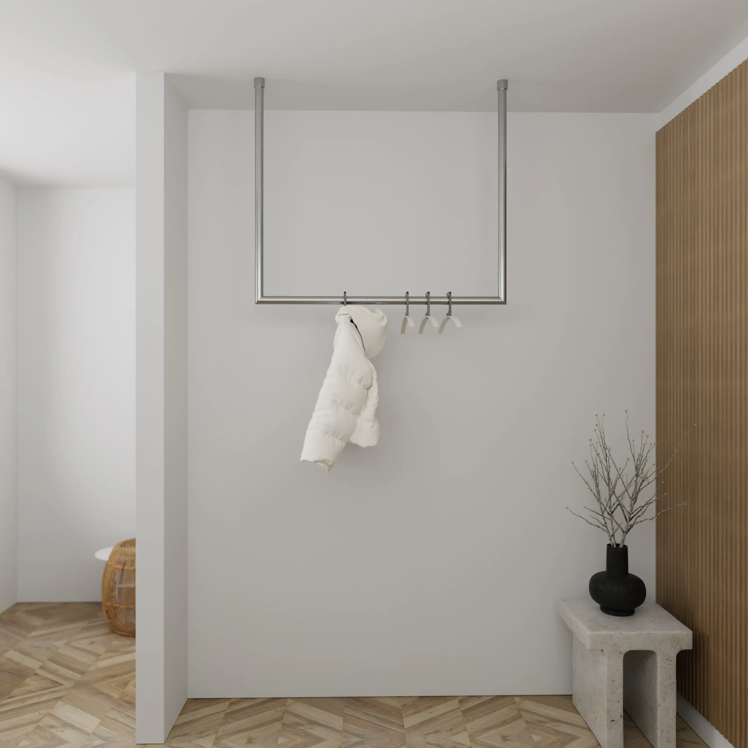 Garderobe Nalen rund Edelstahl in einem Interieur mit Kleidung an der Wand montiert.