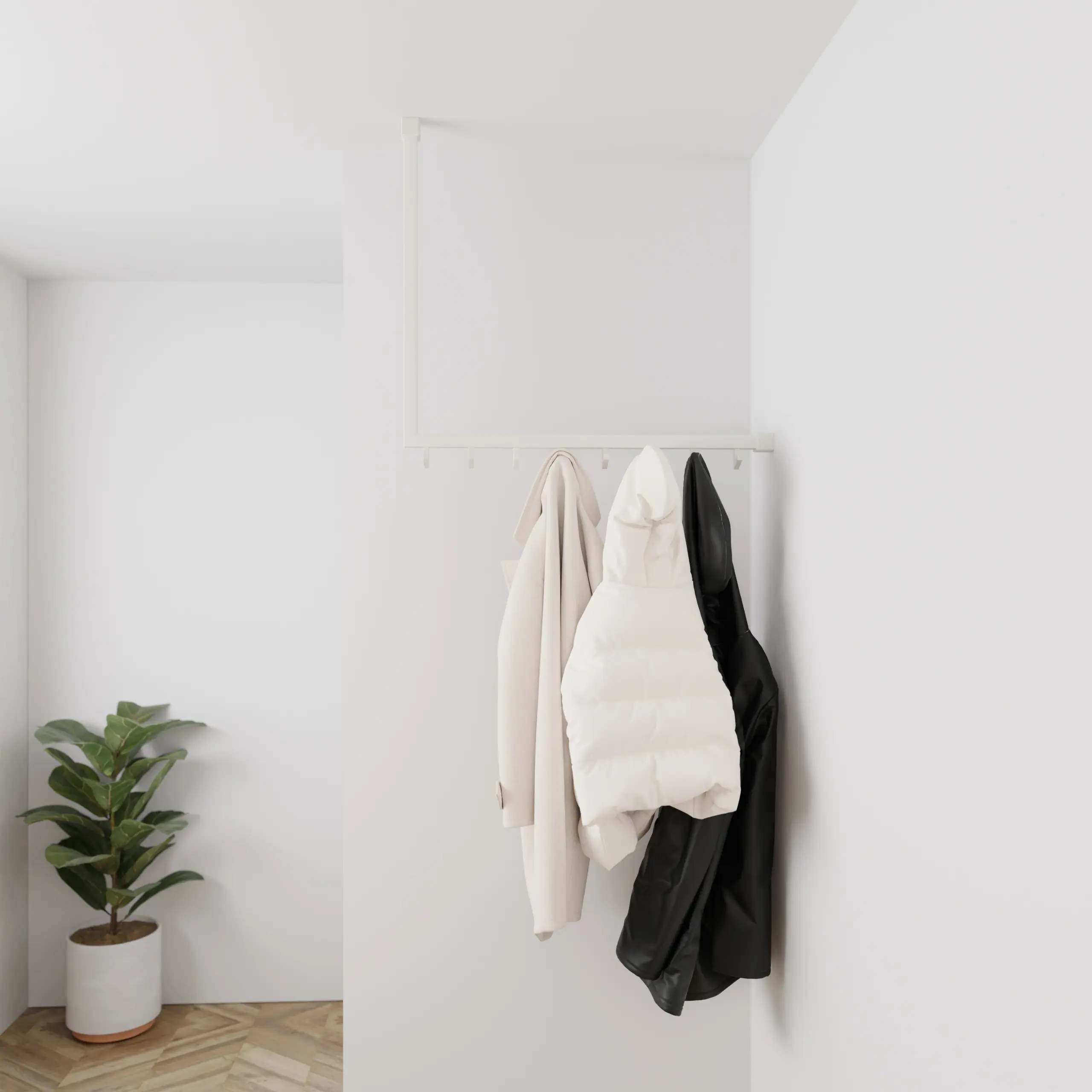 Garderobe Lovan quadratisch weiß in einem Interieur mit Kleidung an der Wand montiert.