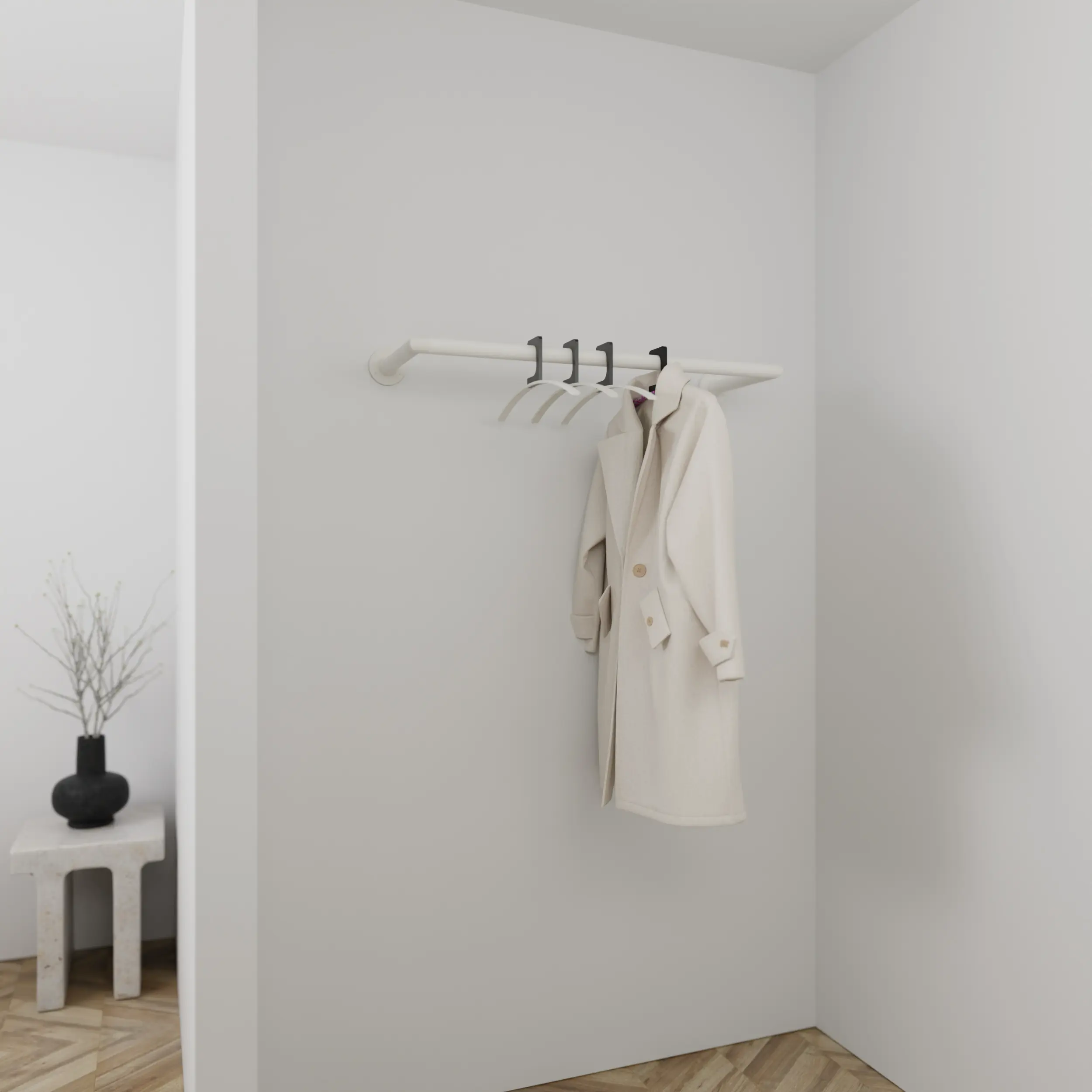 Wandgarderobe Sonel rund weiß in einem Interieur mit Kleidung an der Wand montiert.