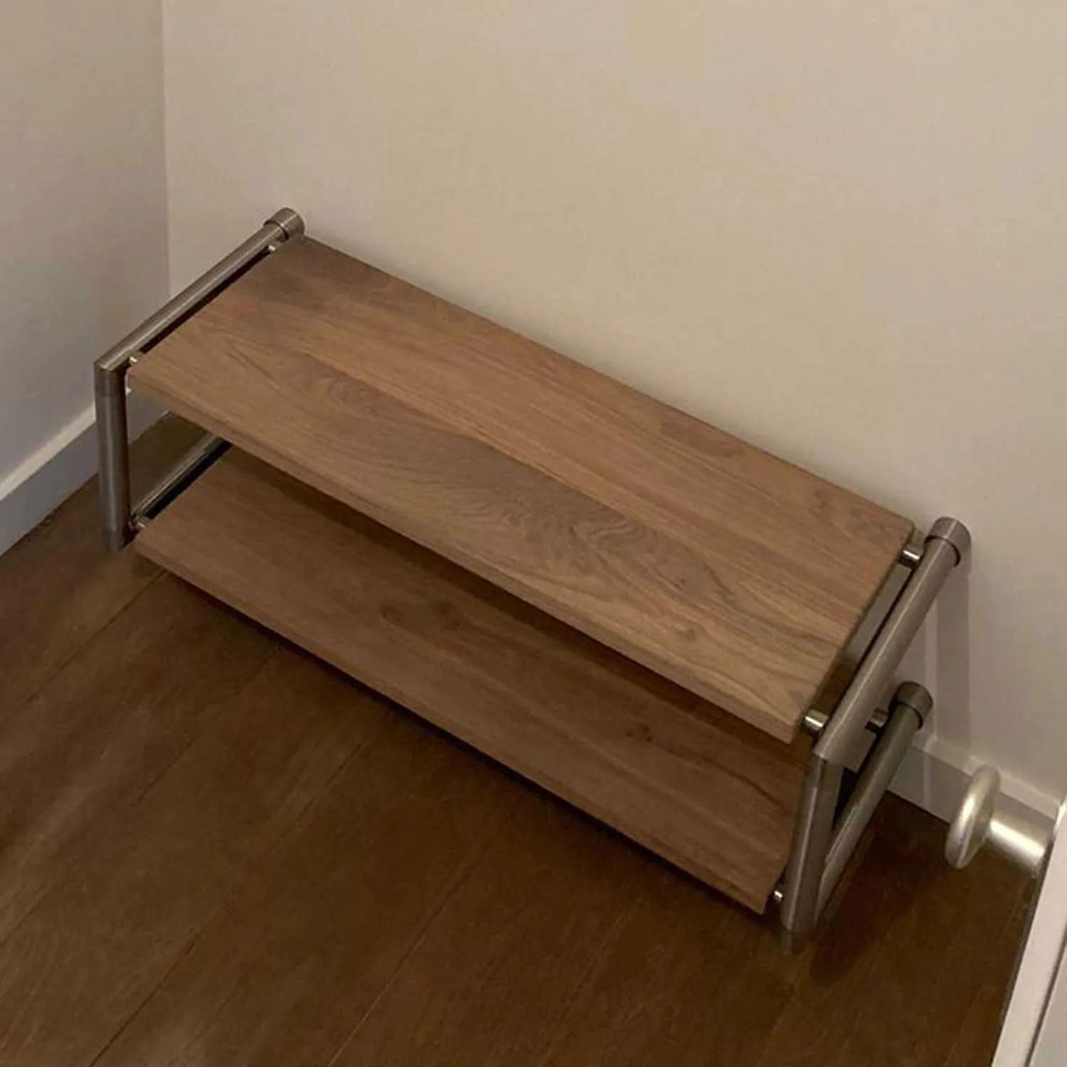 Shoe rack Breno round stainless steel shown as a cut-out straight front view.