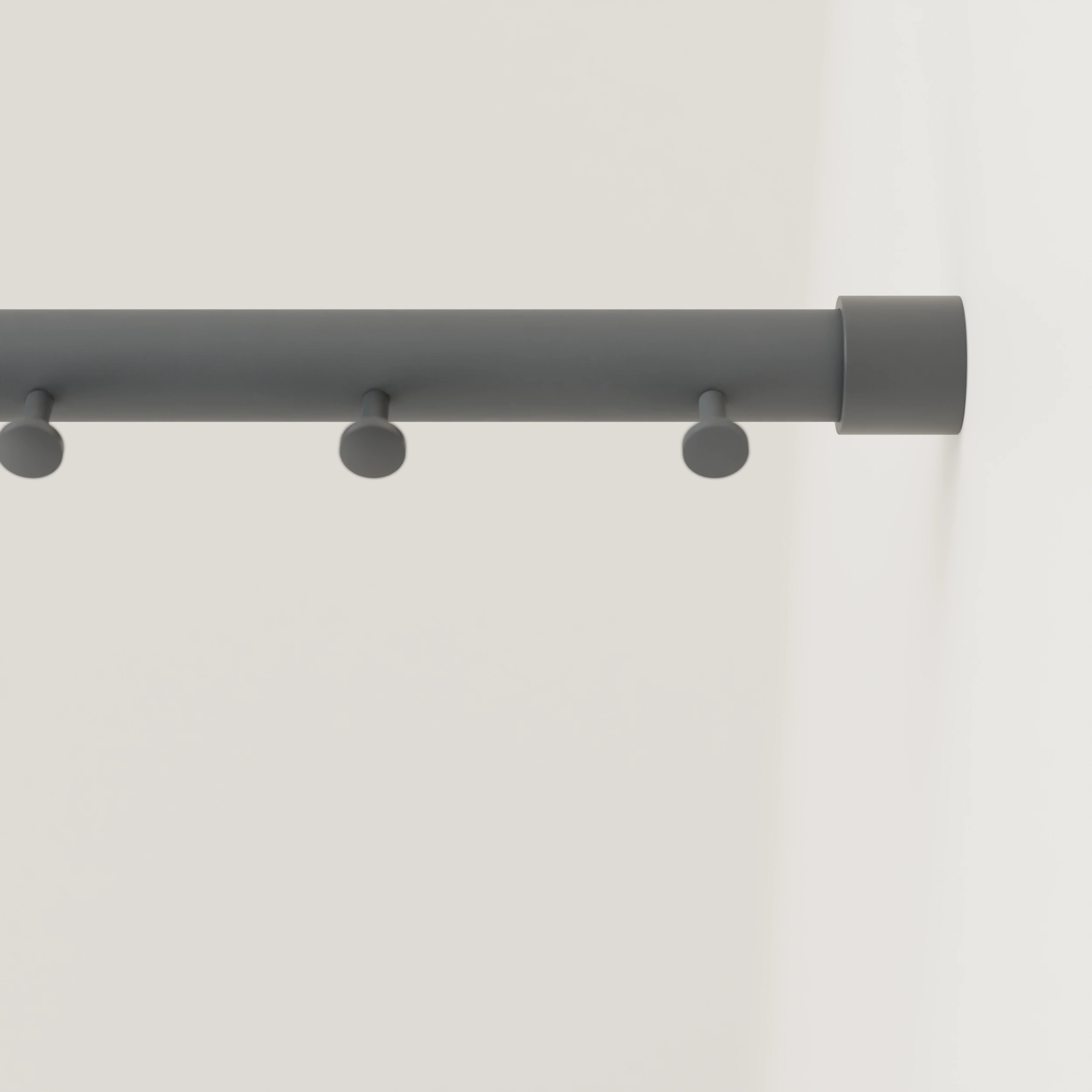 Clothes rail B round anthracite mounted on the wall in an interior with clothing.