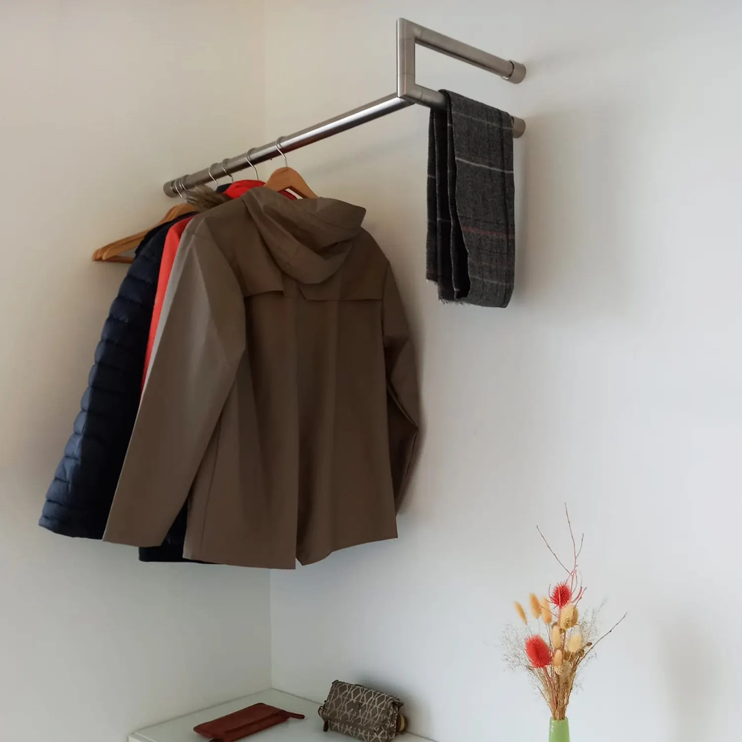 Wall-mounted coat rack Lorien round stainless steel left corner shown as a cut-out straight front view.