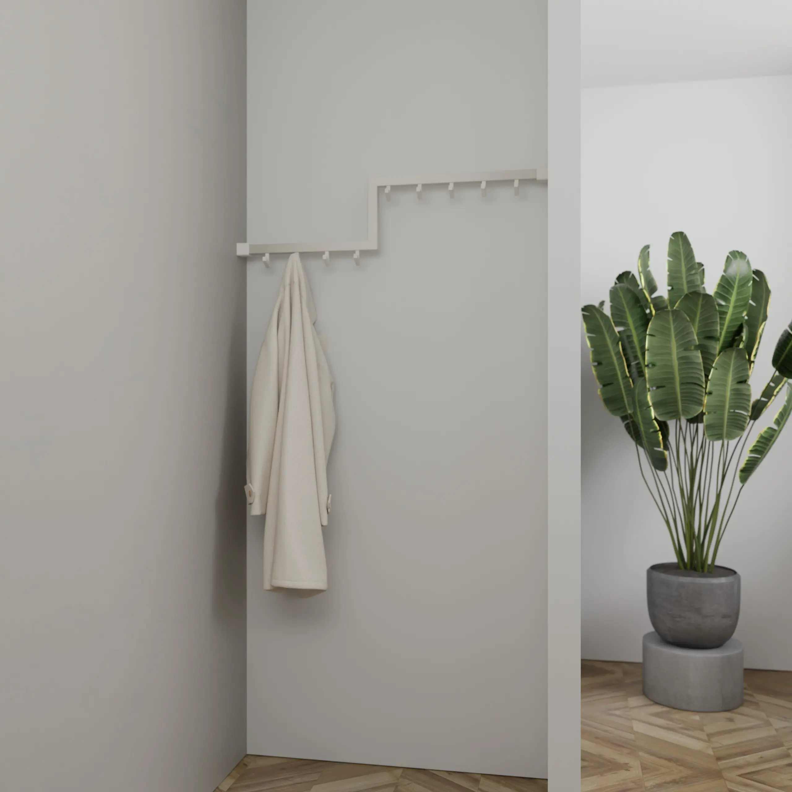 Wandgarderobe Geren quadratisch weiß in einer Eckaufstellung an der Wand mit Kleidung montiert.