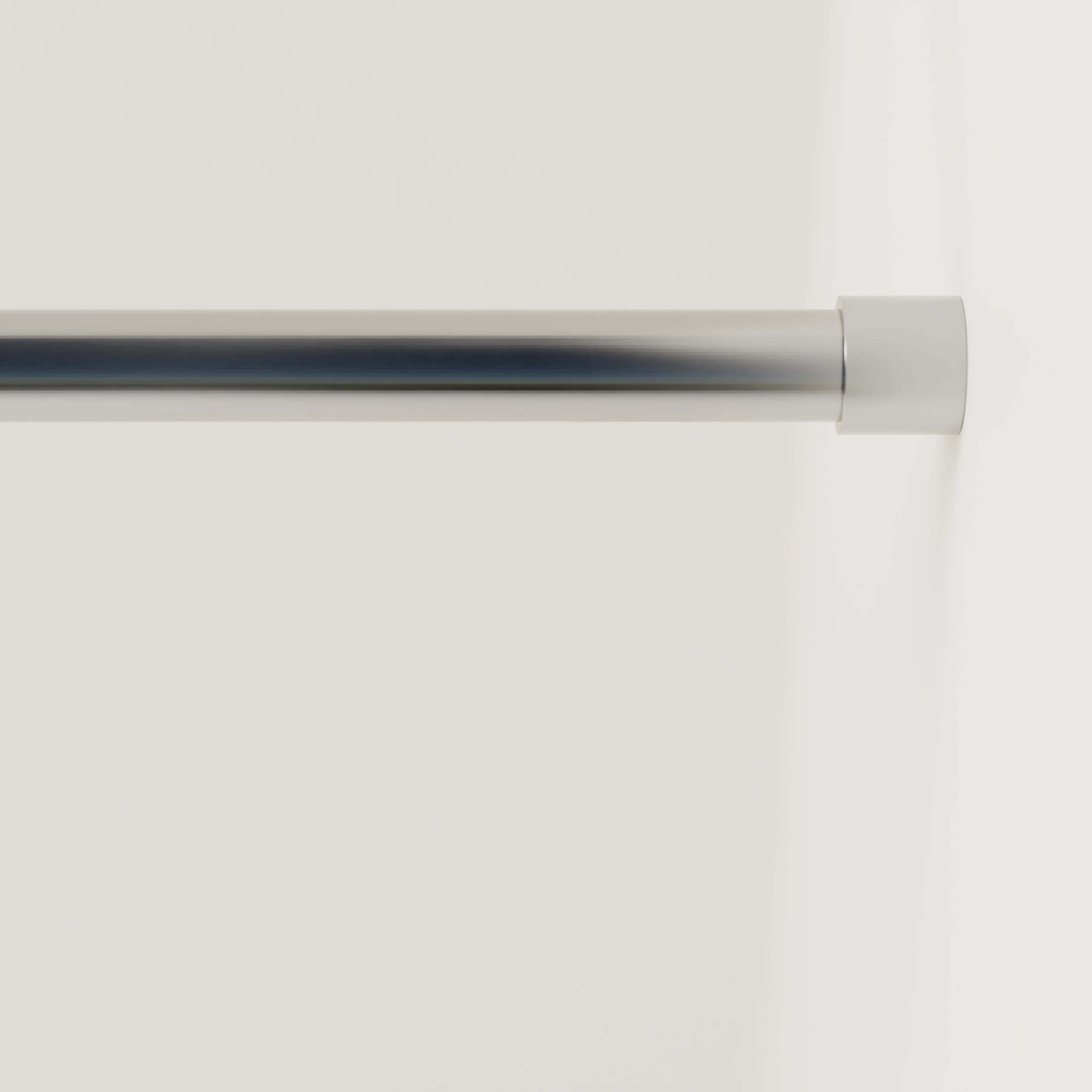 Garderobestang B rond RVS aan de wand gemonteerd in een interieur met kleding.