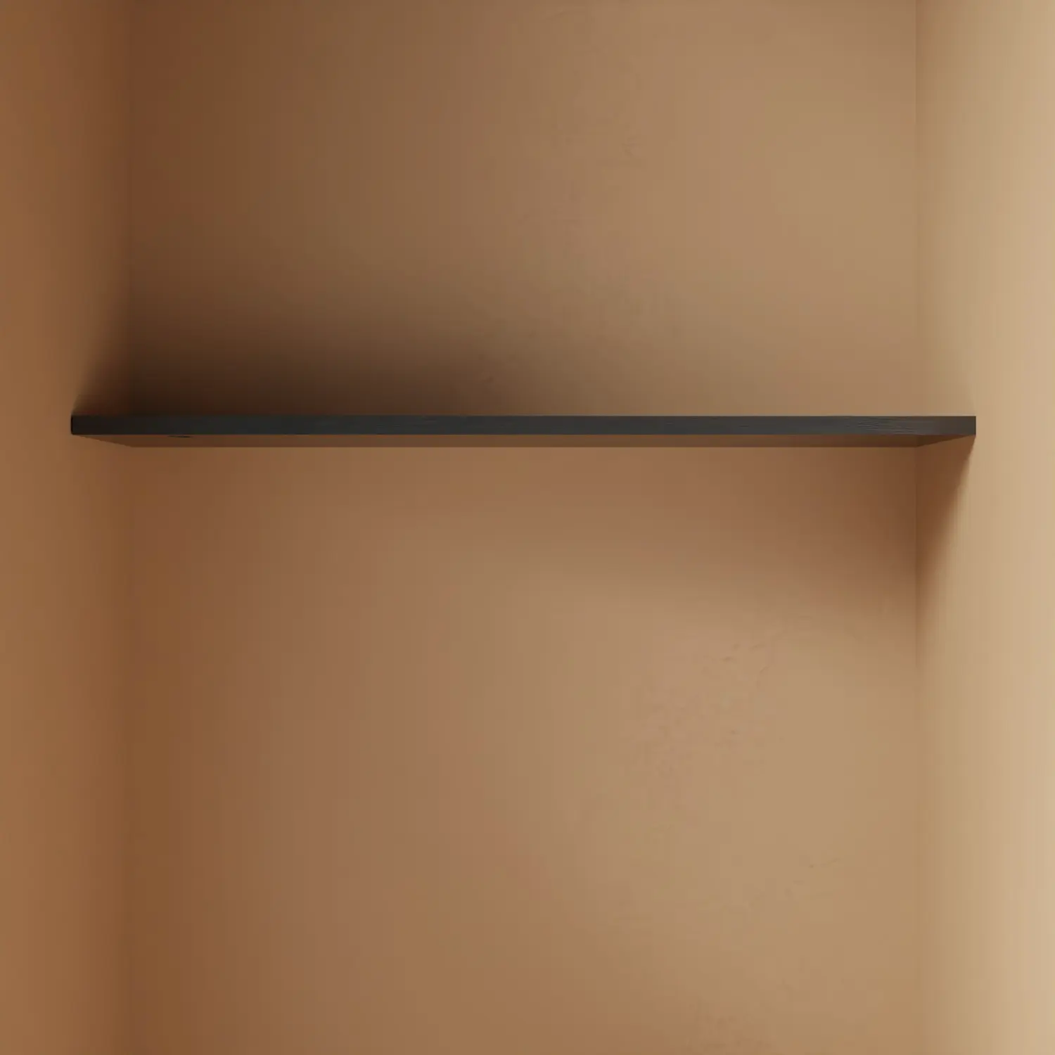 Wandplank Noma zwart aan de wand geplaatst als wandplank met kledinghanger.