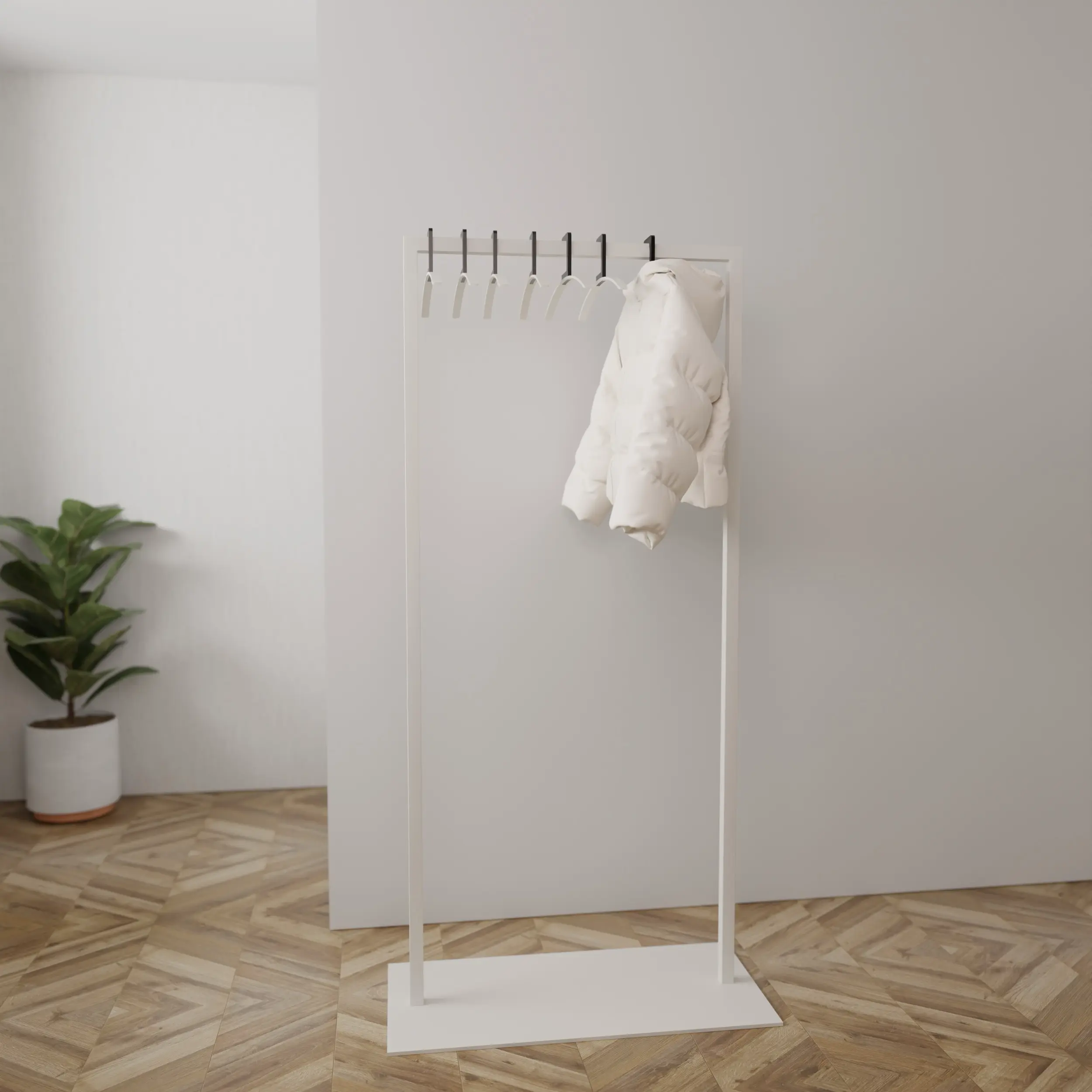 Kapstok Taren wit aan de wand gemonteerd in een interieur met kleding.