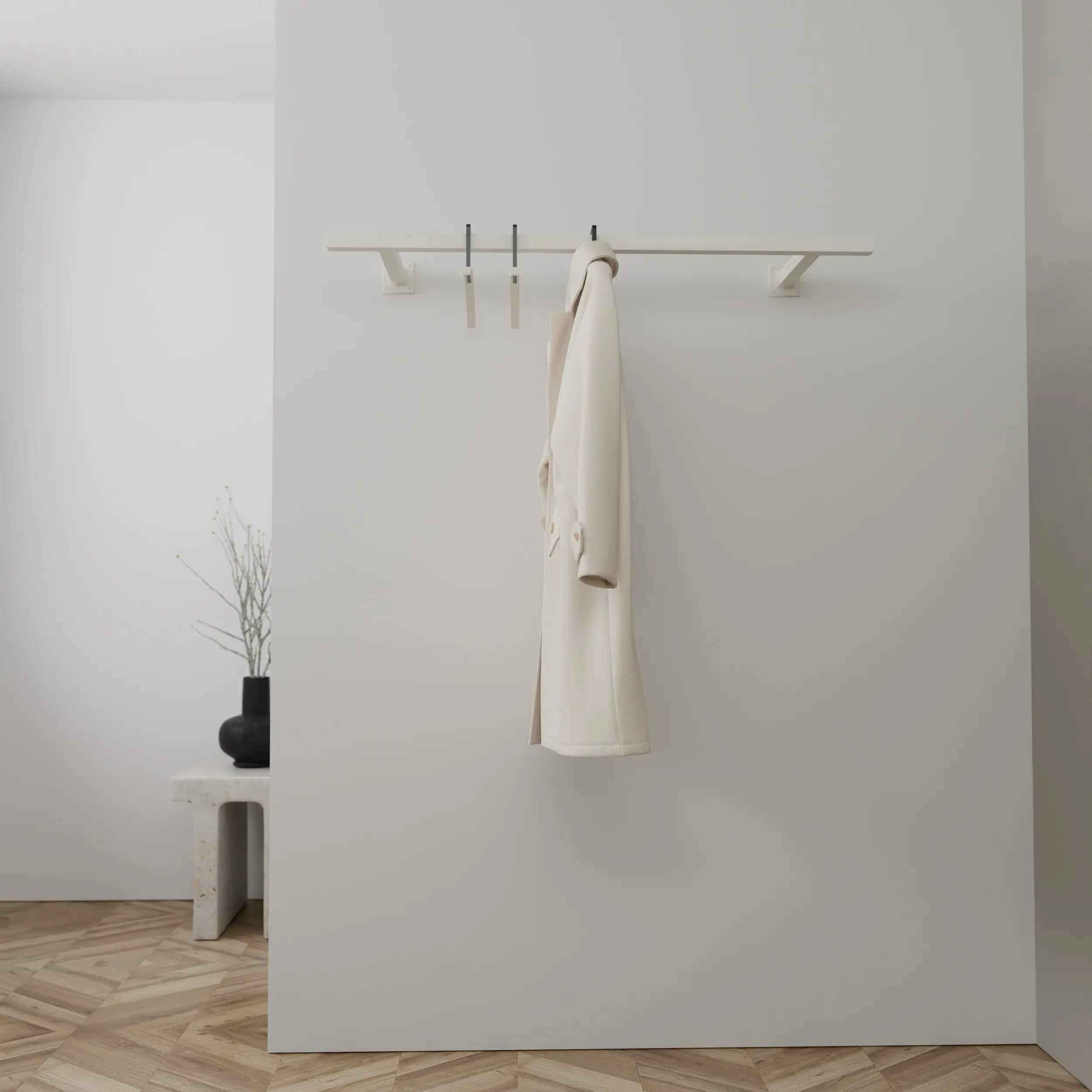 Garderobe Zelhof quadratisch weiß in einem Interieur mit Kleidung an der Wand montiert.