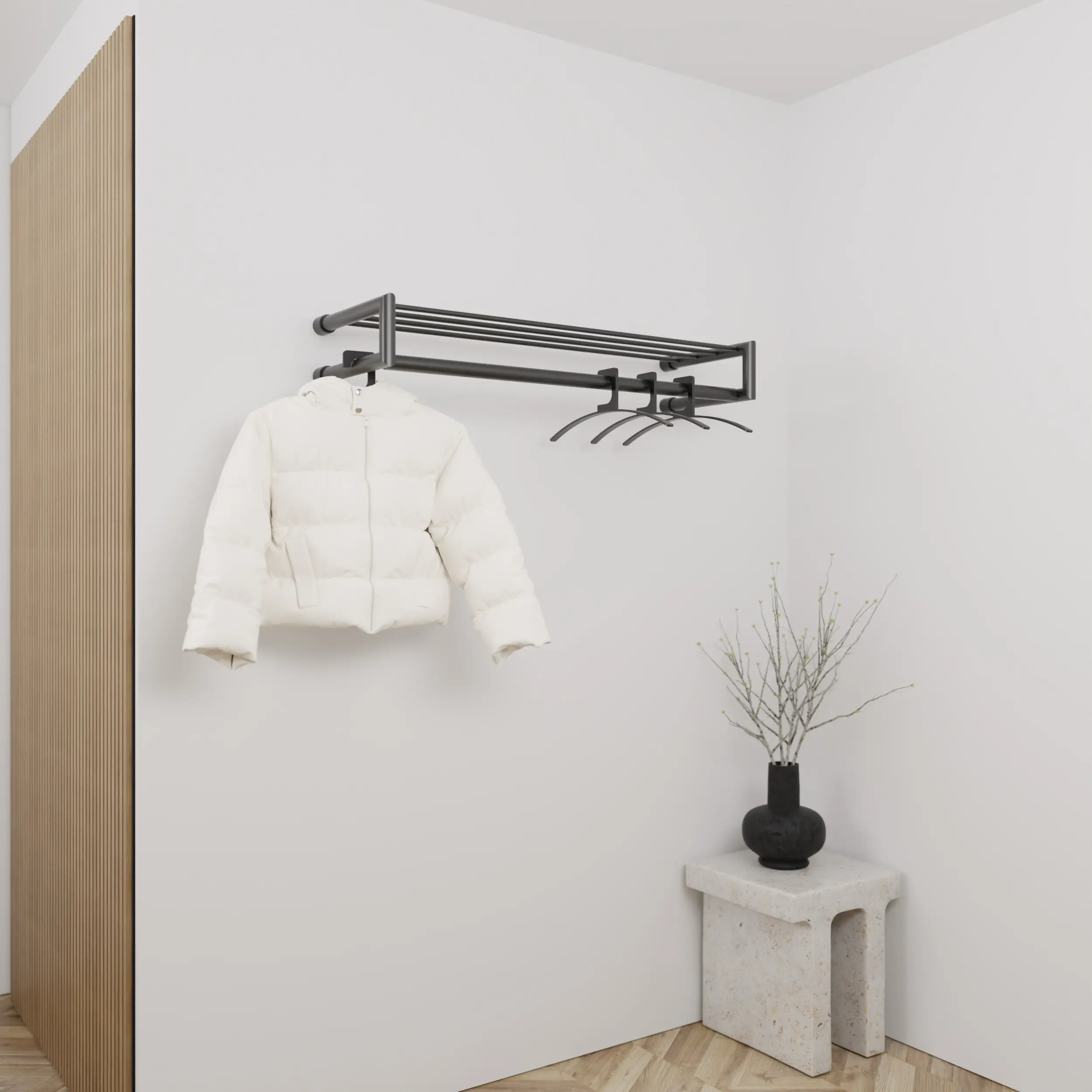 Kapstok Uven rond zwart aan de wand gemonteerd in een interieur met kleding.